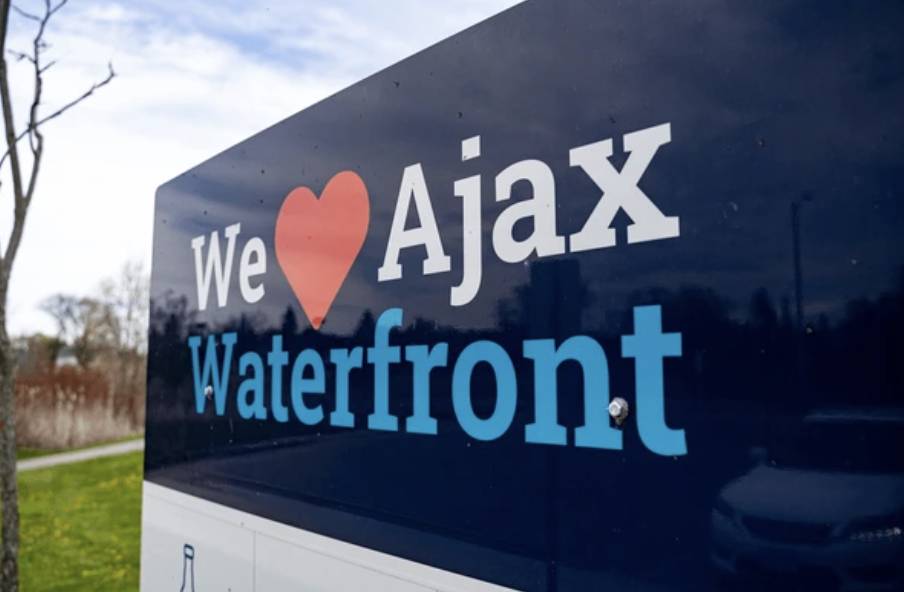 We Love Ajax Waterfront sign representing the window and door installation service area for Stone River Contracting in Ajax, Ontario.